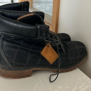 Black Timberland boots, size 13, width square patterns on the stitching
